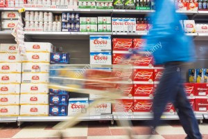 man-with-cases-of-beer-in-shopping-trolley-in-supermarket-uk-FJ8EMF